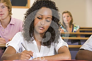 Female college student listening to a lecture