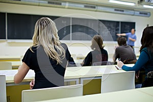 Female college student sitting in a classroom