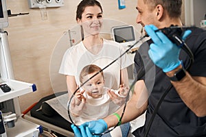 Female communicating with friendly endoscopist before endoscopy of her child