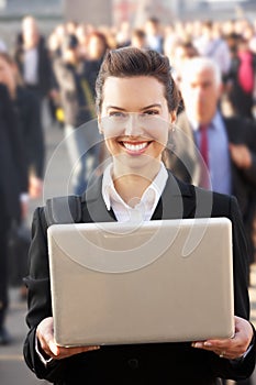 Female commuter in crowd photo