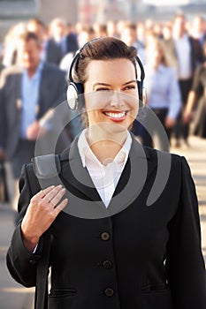 Female commuter in crowd photo