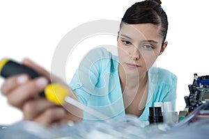 Female computer engineer repairing computer motherboard