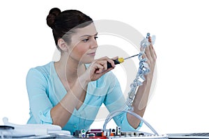 Female computer engineer repairing computer motherboard