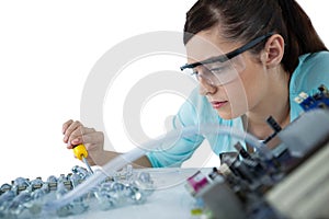 Female computer engineer repairing computer motherboard