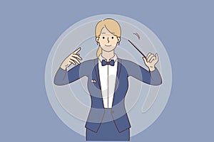 Female conductor with baton in hands