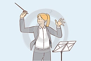 Female conductor leading orchestra