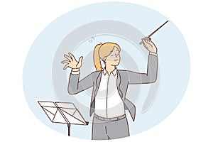 Female conductor leading orchestra