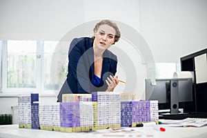 A female construction bureau employee working on a project