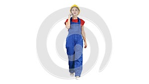 Female construction woman making a call on white background.