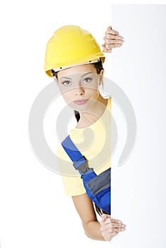 Female construction worker with blank board