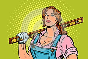 Female construction worker with level