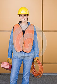 Female construction worker posing in hard-hat