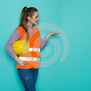 Female Construction Worker Presenting