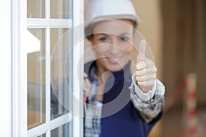 Female construction worker with thumbs up