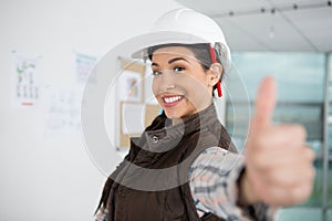 female construction worker with thumbs up