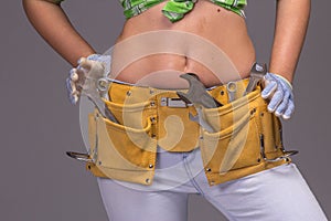 Female Construction Worker With Tool belt.