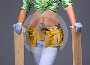 Female Construction Worker With Toolbelt. On White