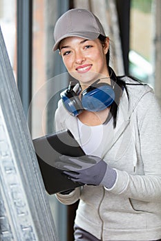 female construction worker using digital tablet