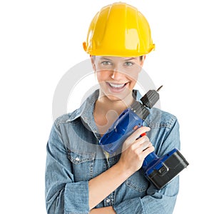 Female Construction Worker Wearing Helmet While Holding Drill