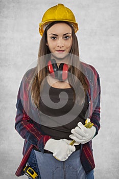 Female construction worker, working as plumber