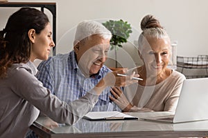 Female consultant have meeting with elderly couple