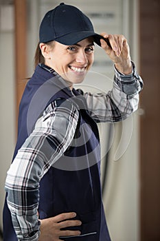 female contractor tipping hat