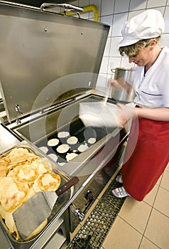 Female cook in kitchen