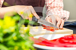 Female cook making fresh shrimp salad in her home cooking, vario