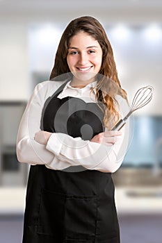 Female Cooker With Apron Smiling
