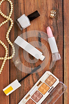 Female cosmetics and jewelry, top view.