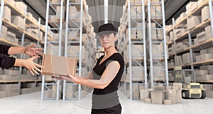 Female courier at distribution warehouse a
