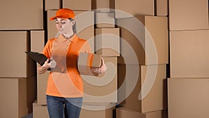 Female courier in orange uniform delivering a parcel to wrong address. Mistake or inaccuracy concept, 4K shot