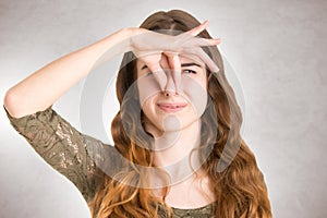 Female Covering Her nose