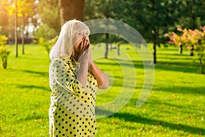 Female covers mouth with hands.