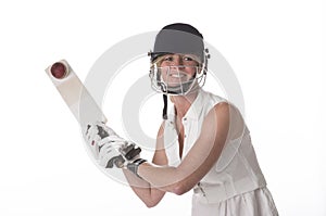 Female cricketer hitting a ball