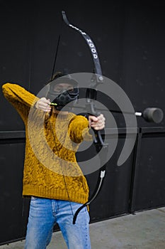 Female with crossbow arrows bow. The Archer takes aim, sharpshooter. Crossbow club