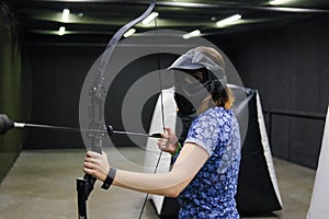 Female with crossbow arrows bow. The Archer takes aim, sharpshooter. Crossbow club