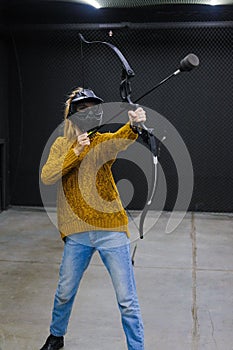 Female with crossbow arrows bow. The Archer takes aim, sharpshooter. Crossbow club