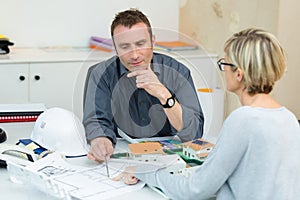 female customer and architect on construction site