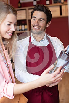 female customer being advised in liquor store