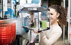 Female customer buying new terrarium or aquarium