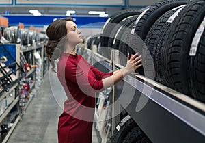 Female customer choosing new tires