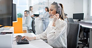 Female customer service representative in headset consulting clients. Call center, business and technology concept