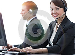 Female Customer Services Agent With Headset Working In A Call Ce