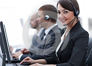 Female Customer Services Agent With Headset Working In A Call Center