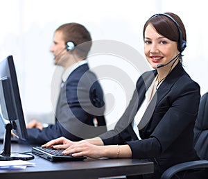 Female Customer Services Agent With Headset Working In A Call Center