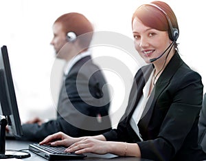 Female Customer Services Agent With Headset Working In A Call Center