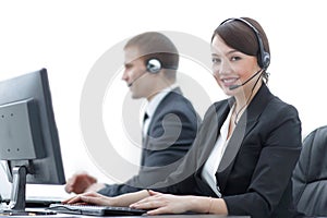 Female Customer Services Agent With Headset Working In A Call Center