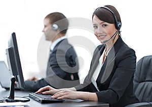 Female Customer Services Agent With Headset Working In A Call Center