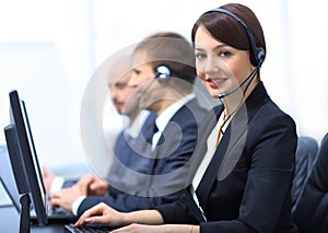 Female Customer Services Agent With Headset Working In A Call Center